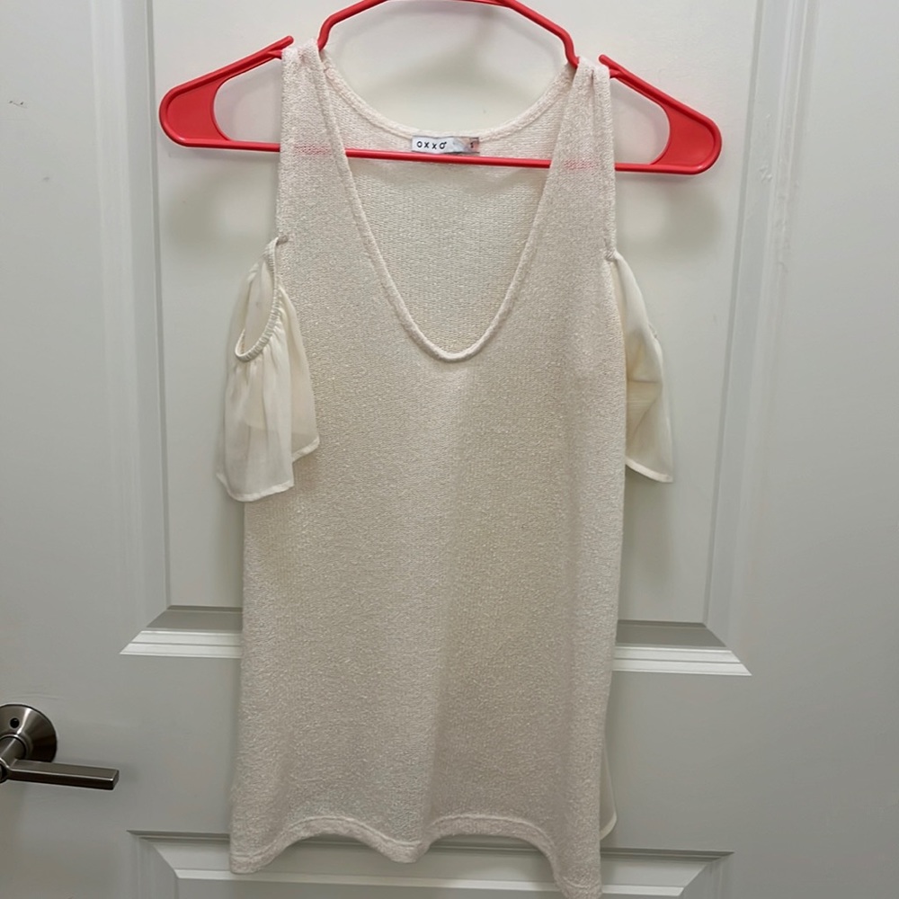 Blouse with cute sleeves on upper arm.